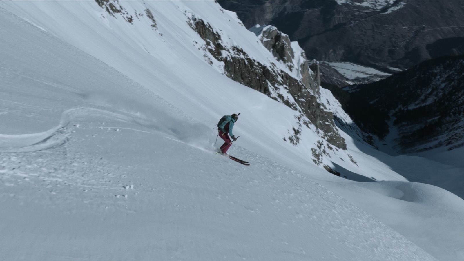 Backcountry couloir descent above the valley — ski touring in Svaneti