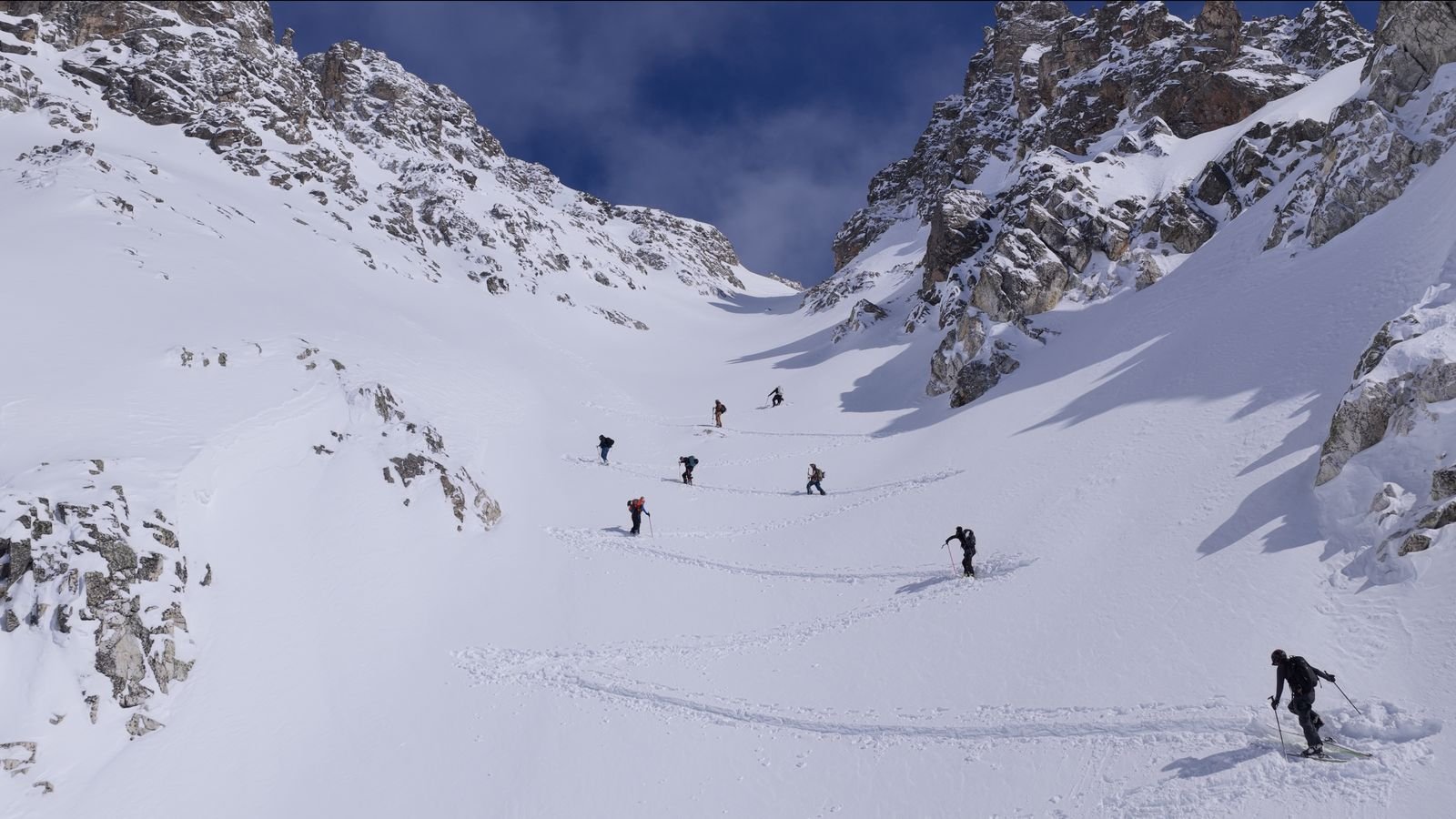 Skier tracks down a couloir near Ushguli