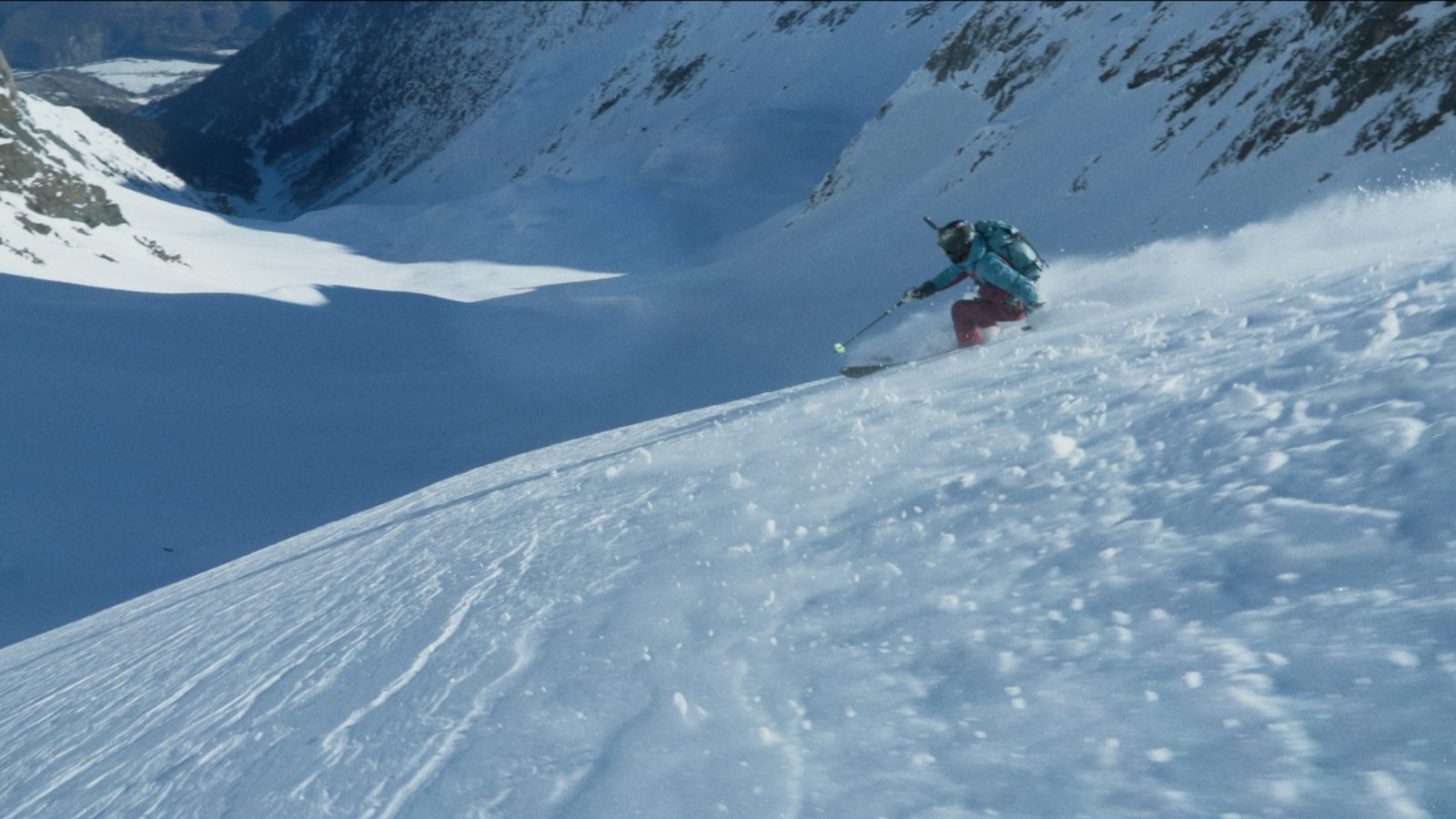 Deep powder turn in a couloir — freeride skiing in Svaneti, Georgia