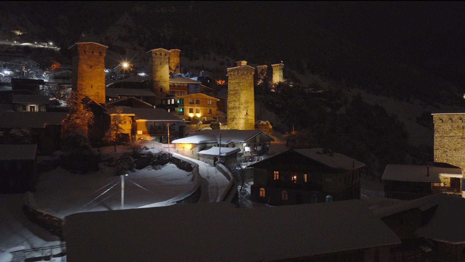 Snow-covered tower neighbourhood at night
