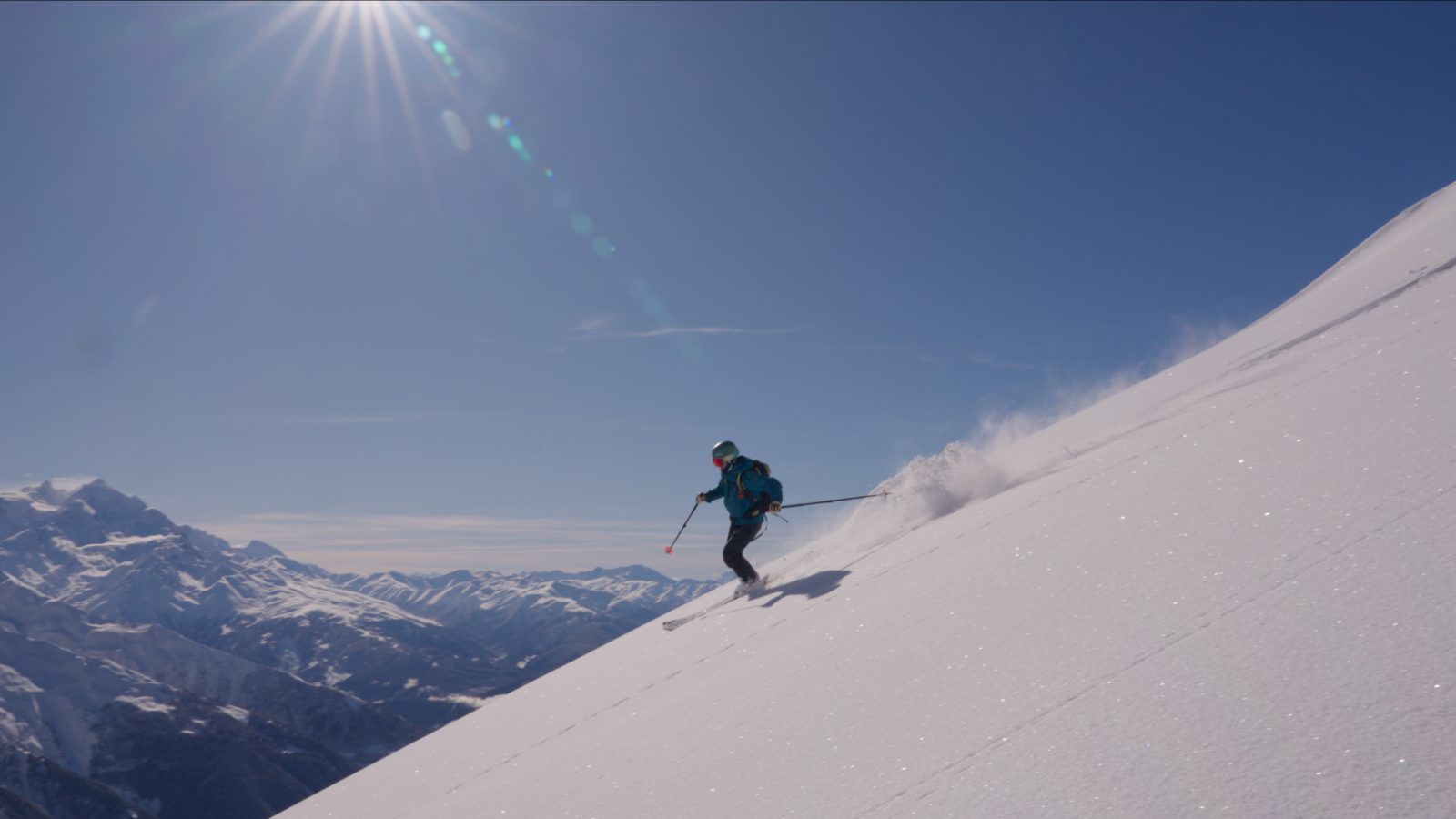 Freeride skiing in Svaneti — deep dry powder on a bluebird day above Mestia