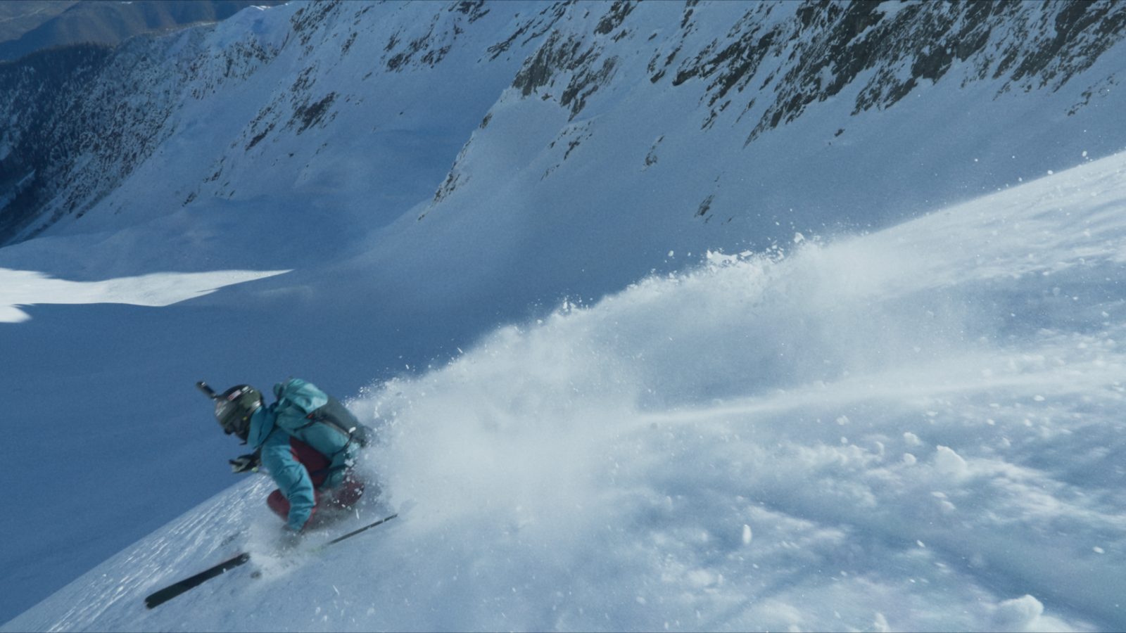 Certified guide leading a freeride group along the summit ridge, Svaneti