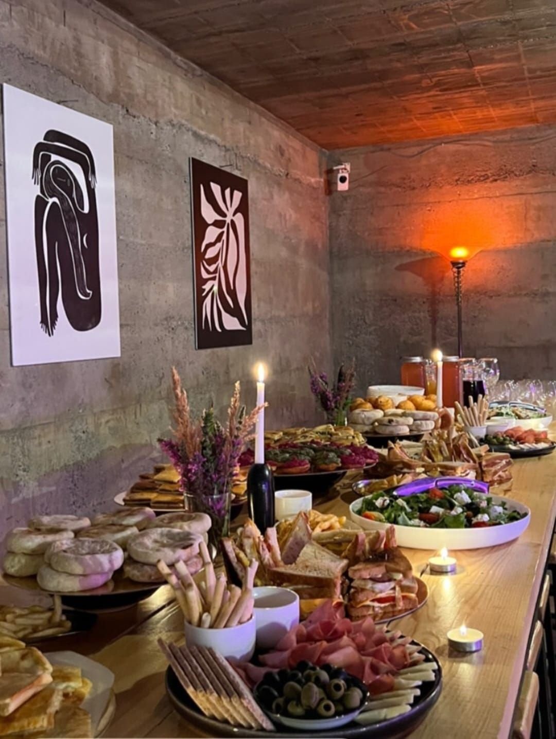 Long supra table laid with Georgian dishes and candles