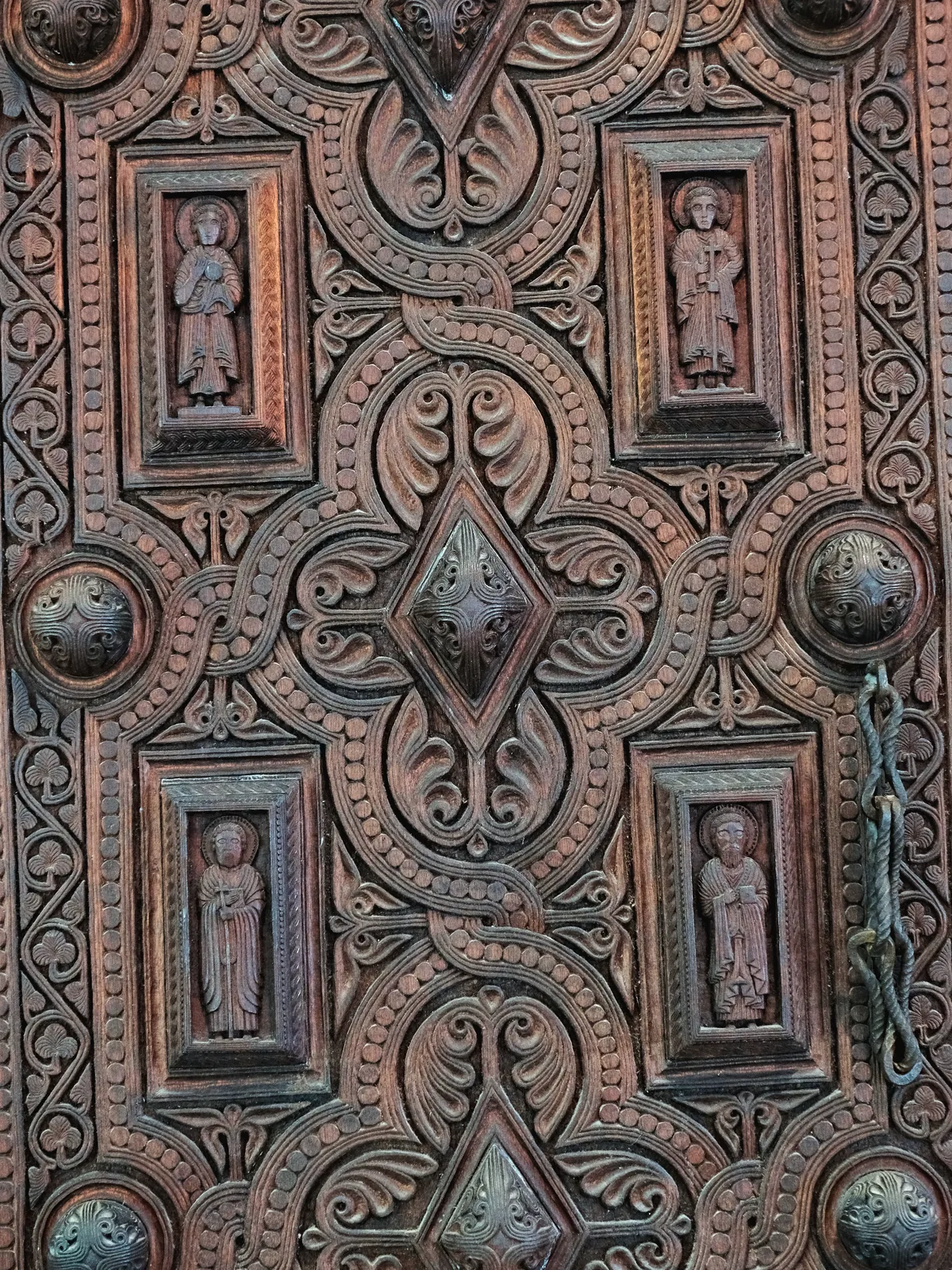 A carved wooden door on display at the Svaneti Museum.