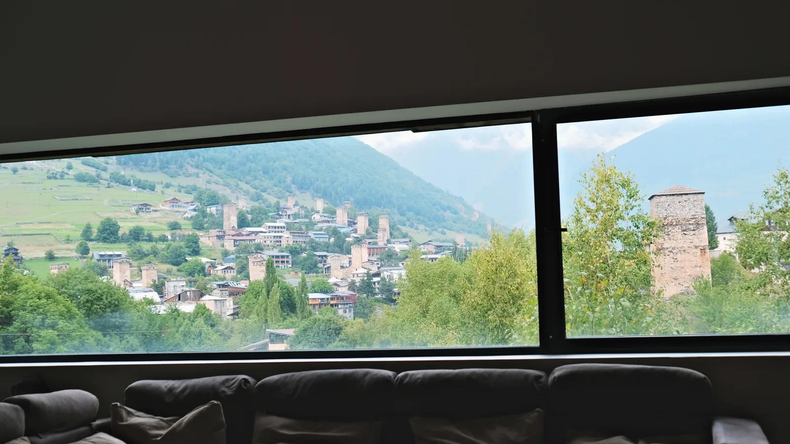 Mestia’s towers seen through a window in the museum lounge.