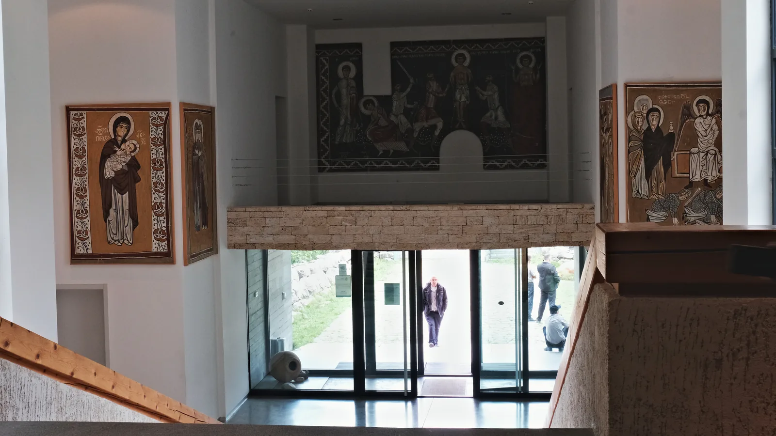 The atrium of the Svaneti Museum in Mestia, with icon and fresco reproductions.