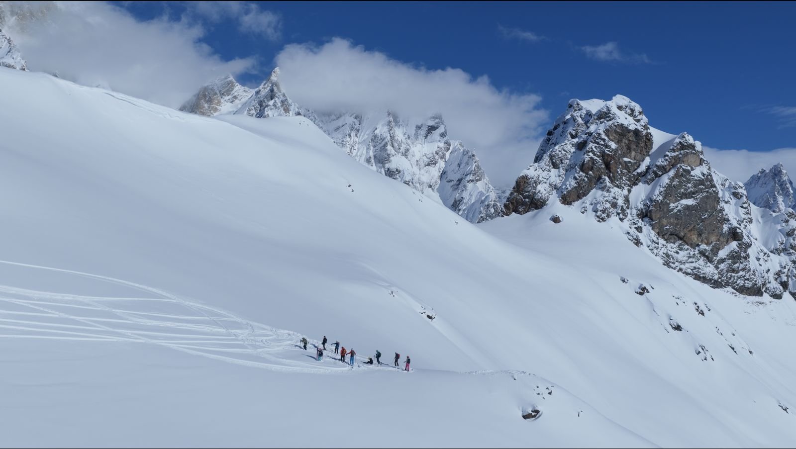Group crossing an open bowl in the Becho valley