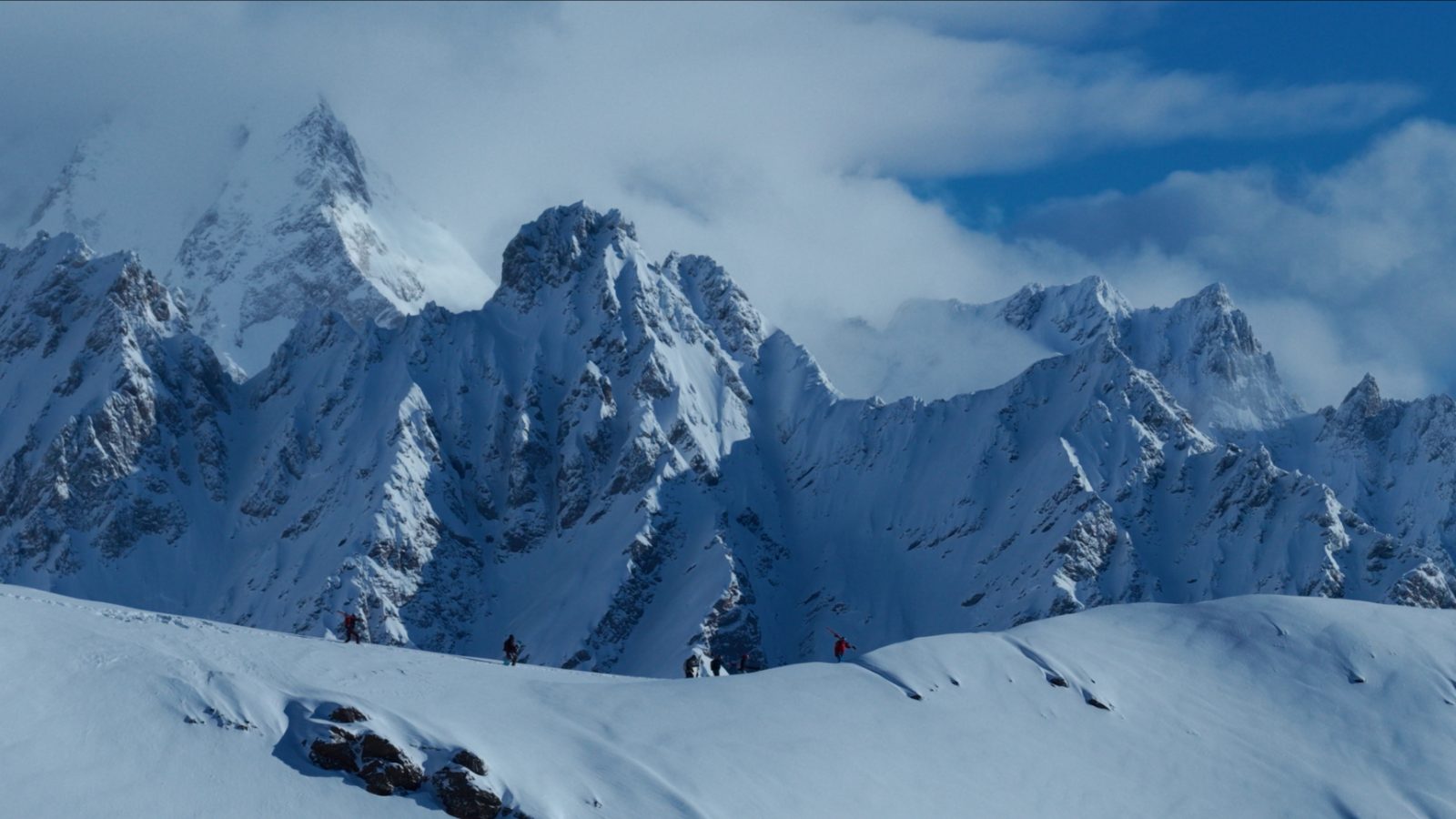 Group on the summit after a heli-drop — Caucasus panorama, Svaneti