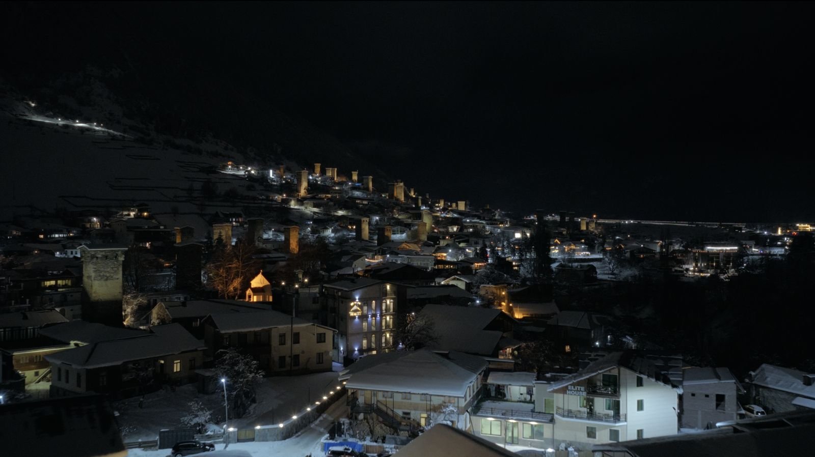 Mestia at night with lit towers