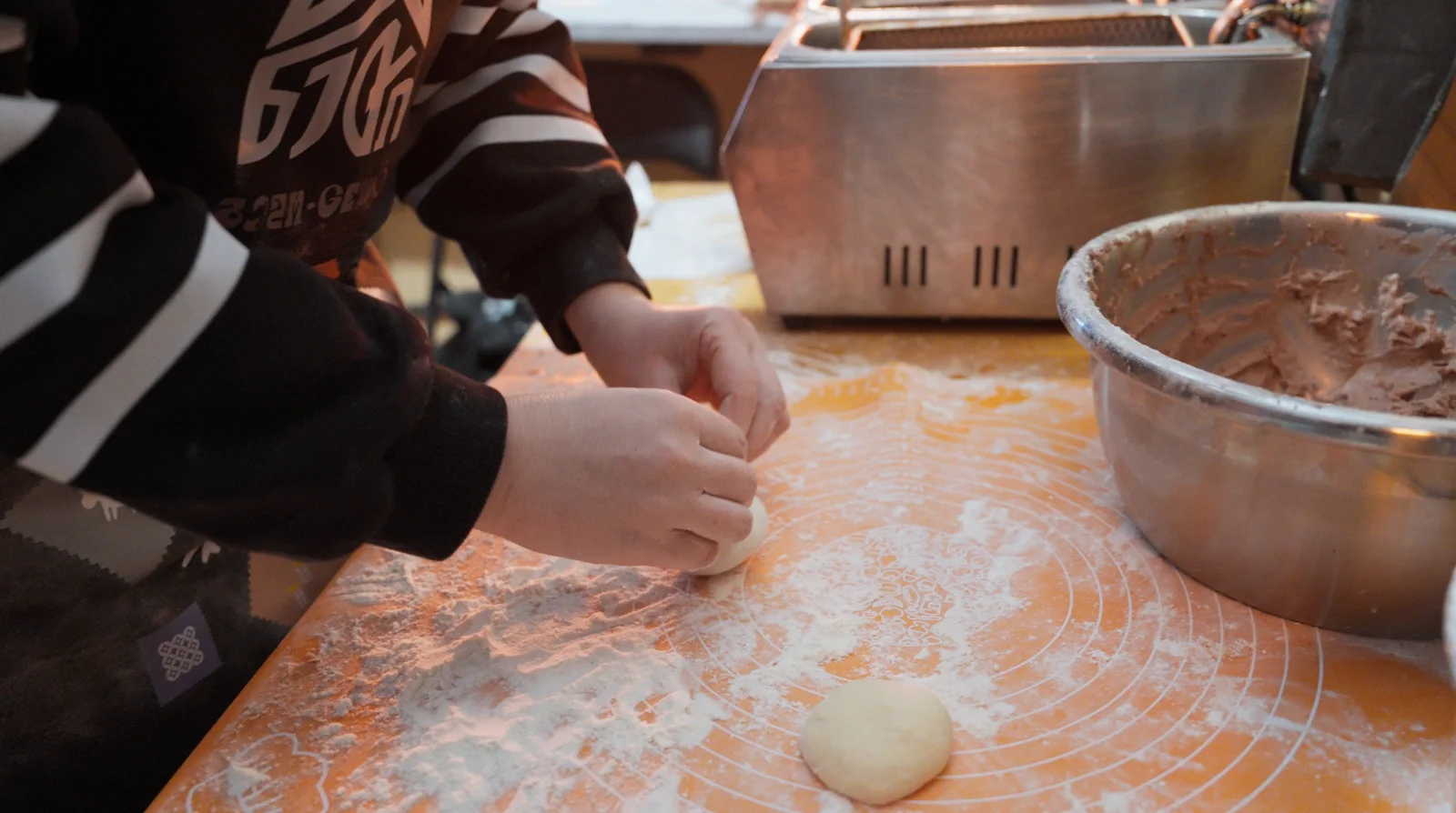 Working bread dough by hand