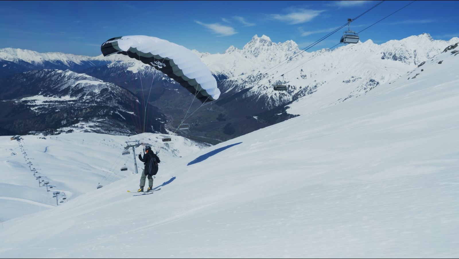 Wind-carved cornice on a ridge above the valley