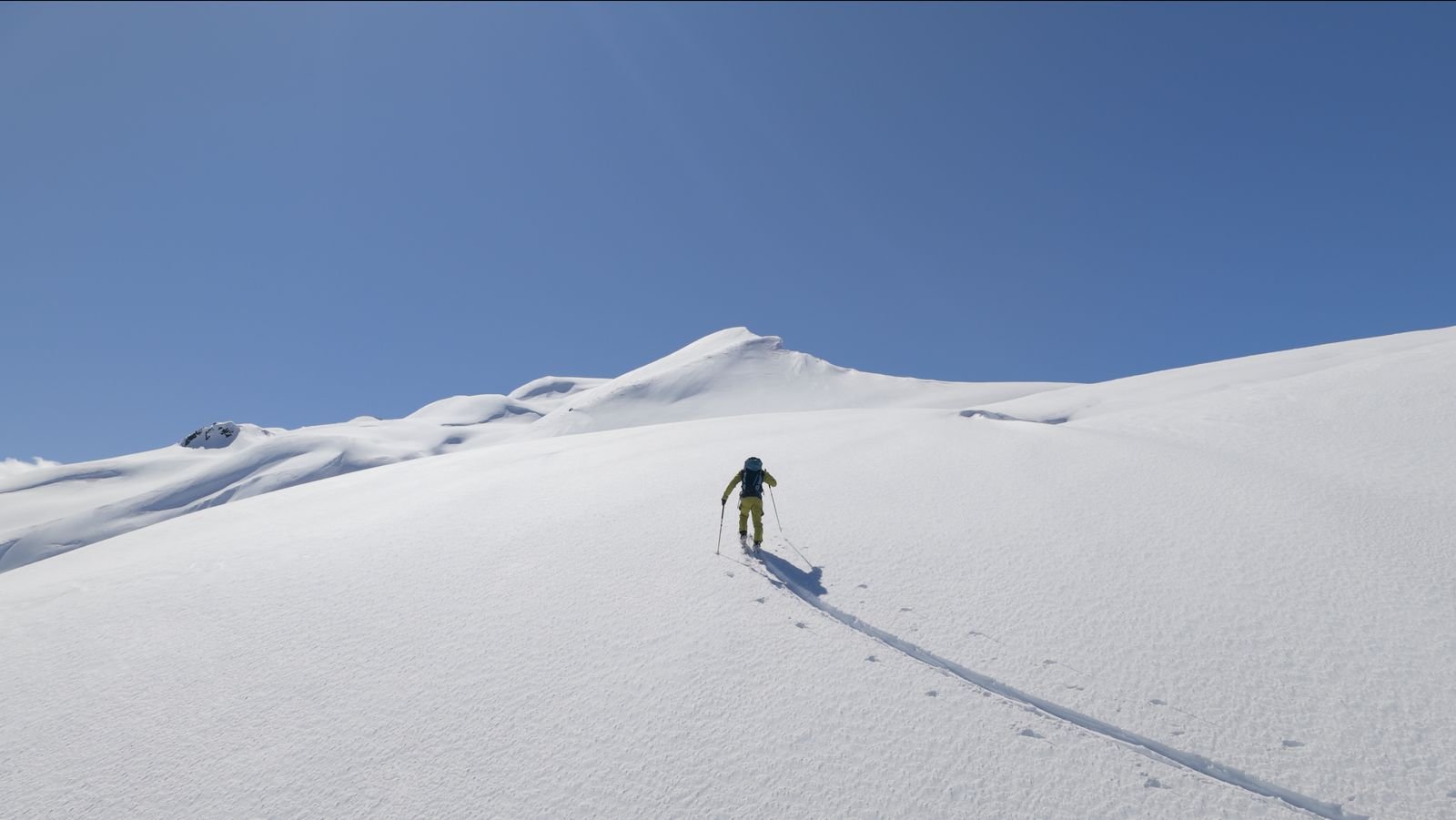 Ski tourer approaching a summit