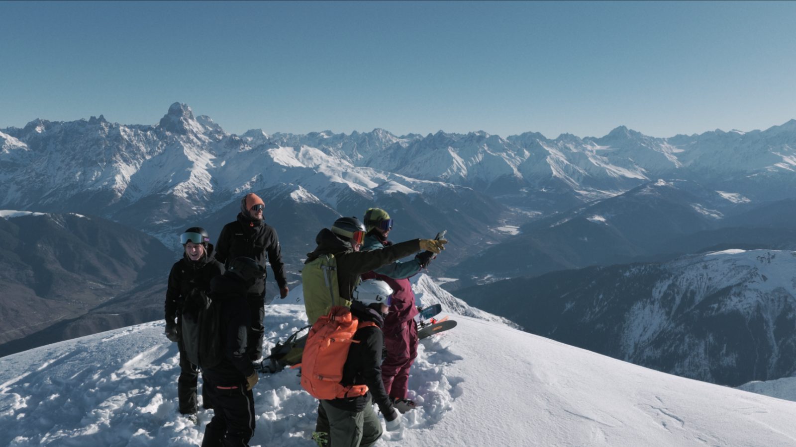 Laila ski tour — skiers at the summit cross at dawn, Svaneti