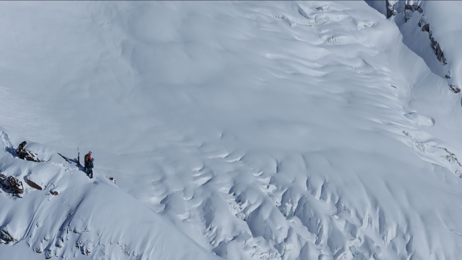 Wind-sculpted snow on an open slope