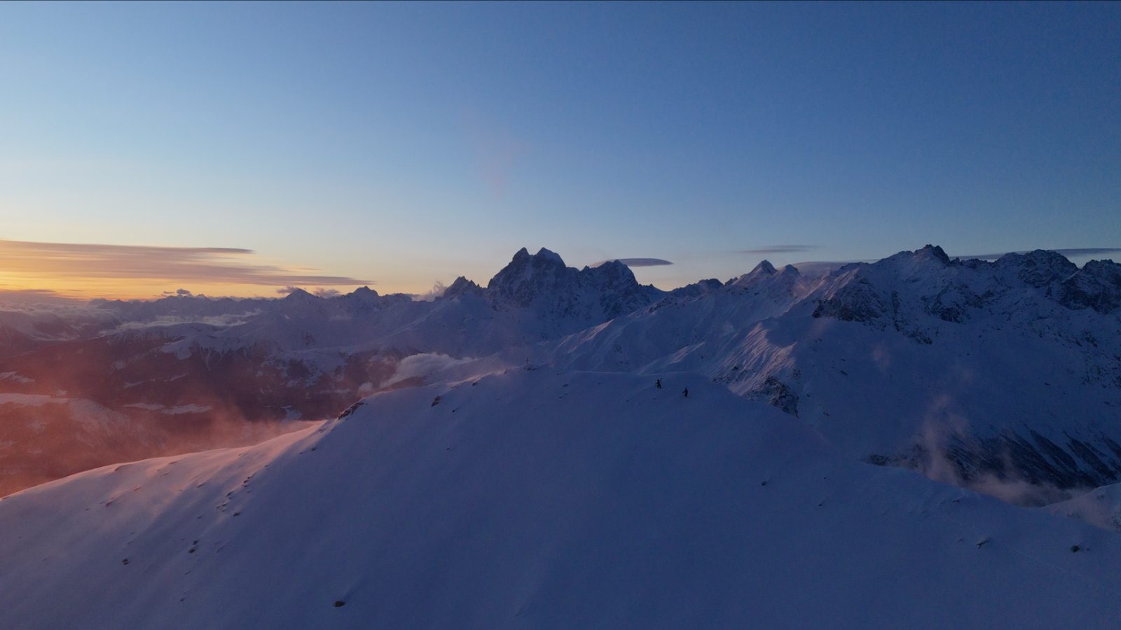 Tetnuldi freeride — skier on a steep open face above the Svaneti valley