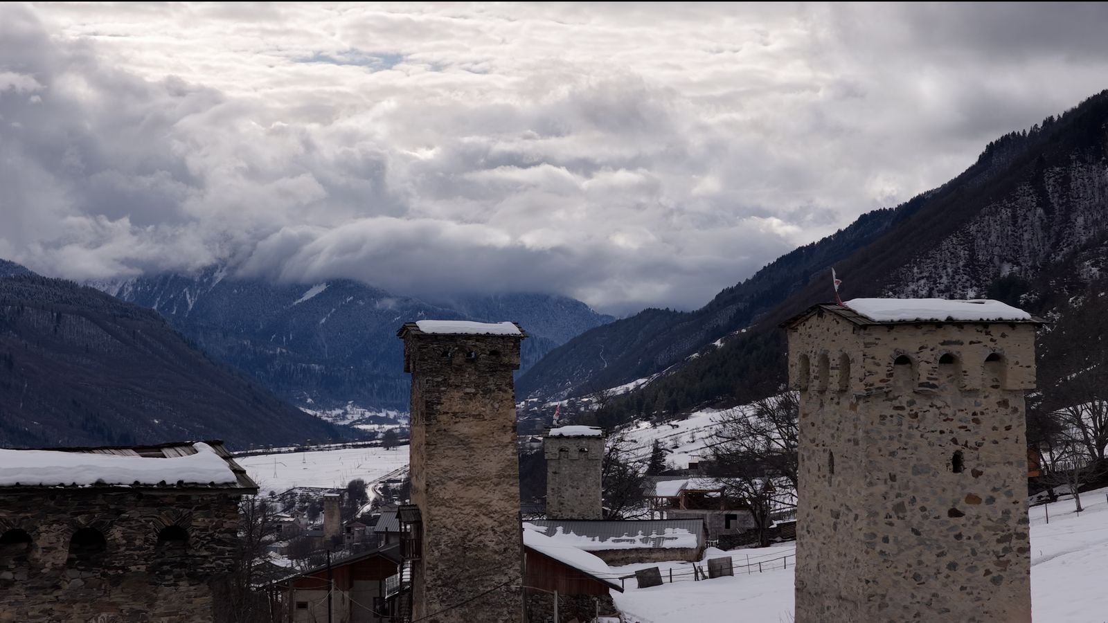 Svan towers with cloud on the ridge behind