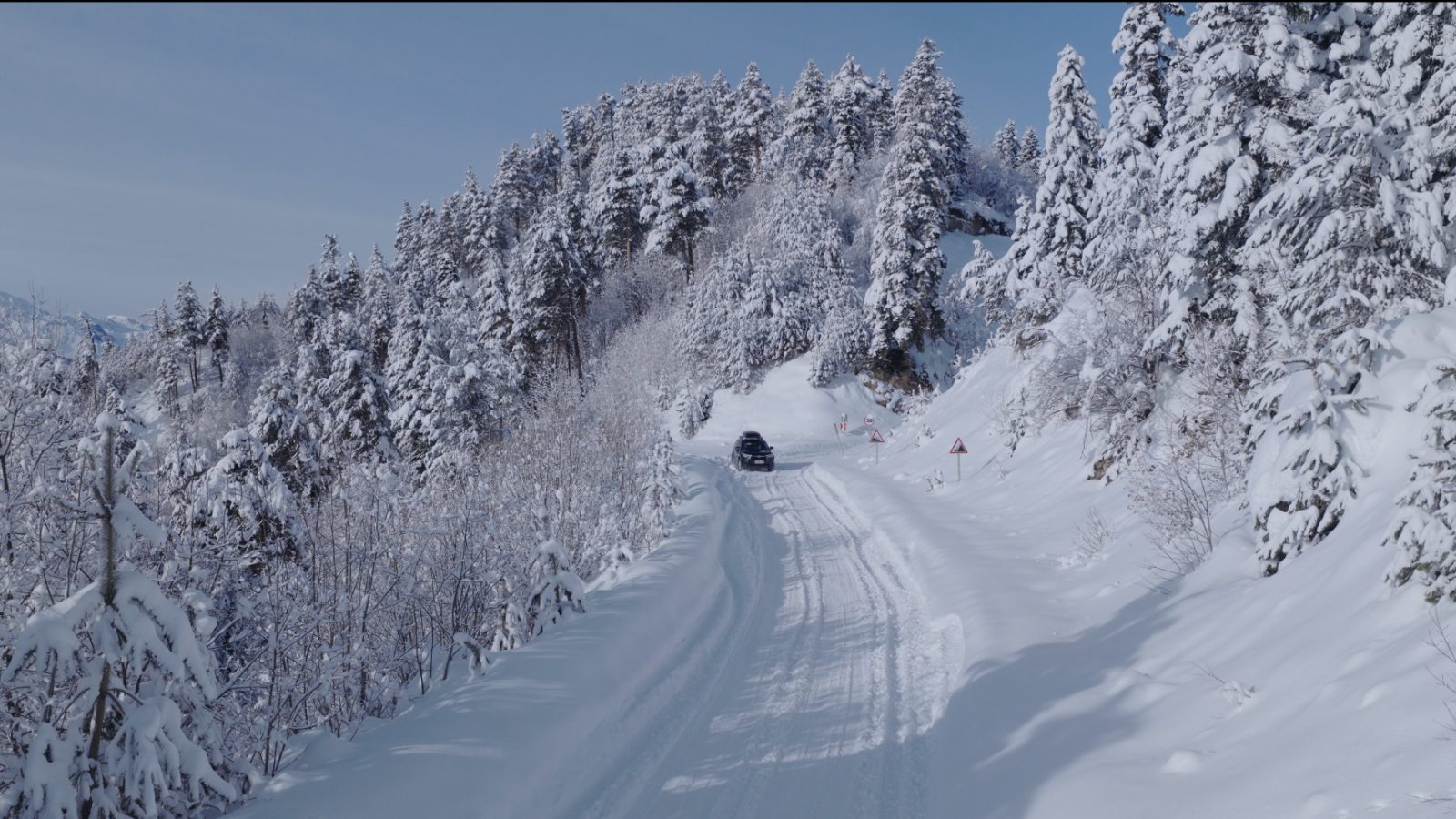 4x4 transfer on the snowy forest road to Mestia — Svaneti winter transfers