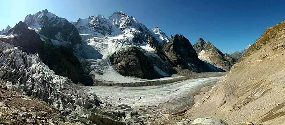 Tviberi glacier flowing down from the peaks