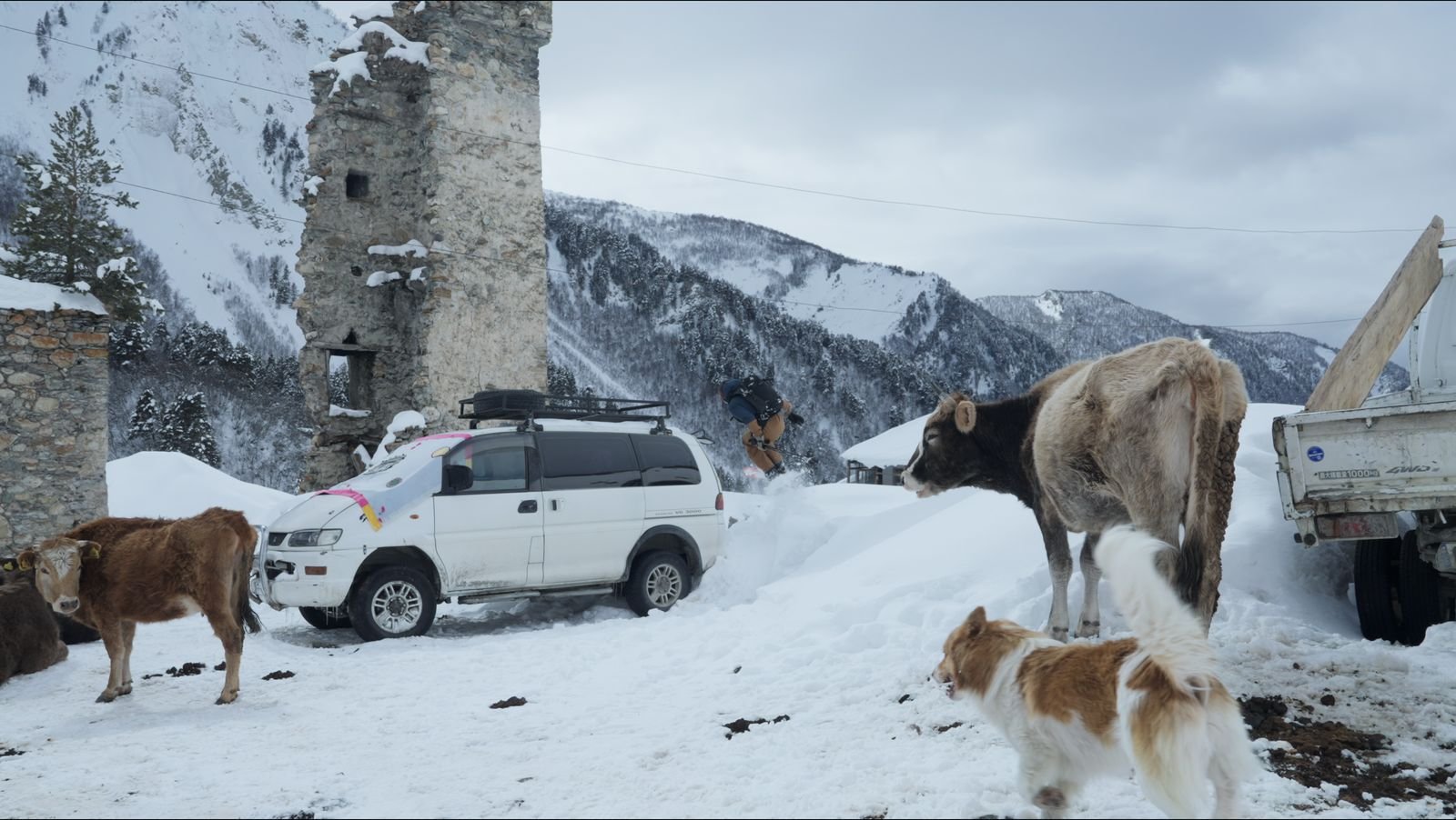 Winter yard in Ushguli with towers